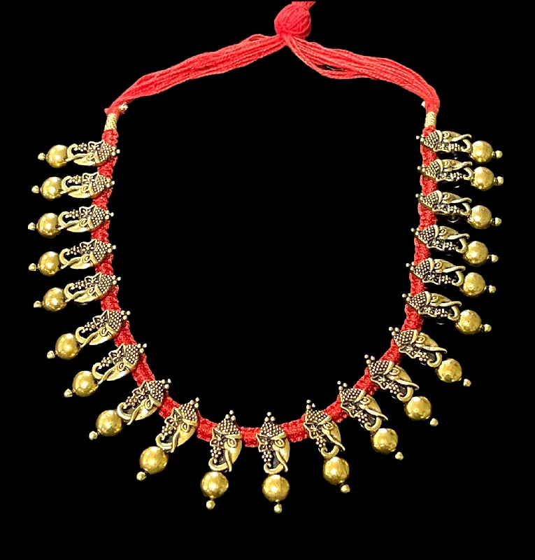 women's spiral necklaces-Ganesha Antique tone Oxidized Gold Red Dori Necklace