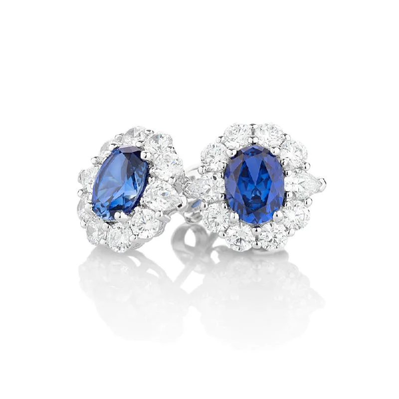 women's zodiac sign earrings-Oval and Round Brilliant stud earrings with ceylon sapphire simulants and 2.6 carats* of diamond simulants in 10 carat white gold