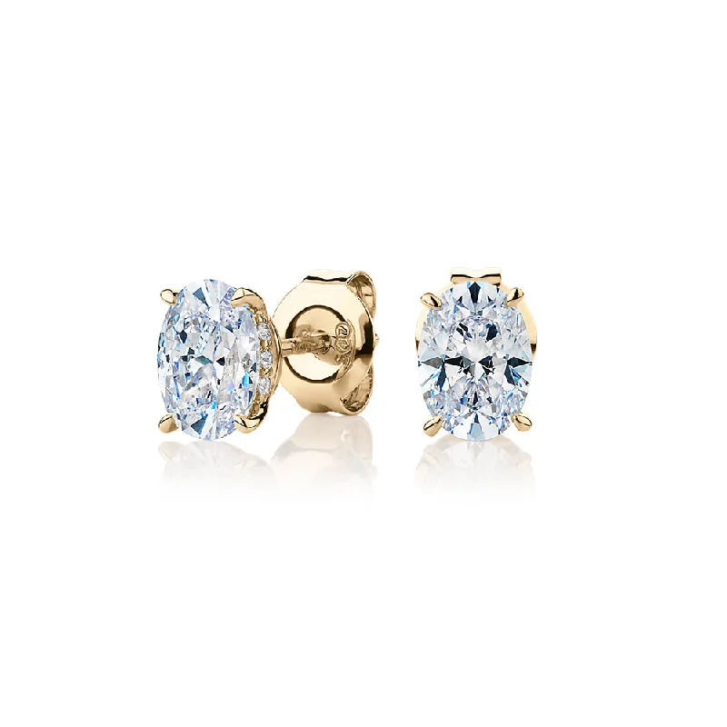 women's gemstone stud earrings-Oval stud earrings with 1.62 carats* of diamond simulants in 10 carat yellow gold