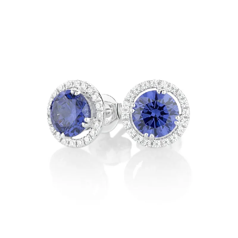 women's adjustable earrings-Round Brilliant stud earrings with tanzanite simulants in 10 carat white gold