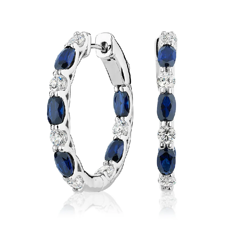 women's romantic diamond earrings-Round Brilliant and Oval hoop earrings with sapphire simulants and 1.32 carats* of diamond simulants