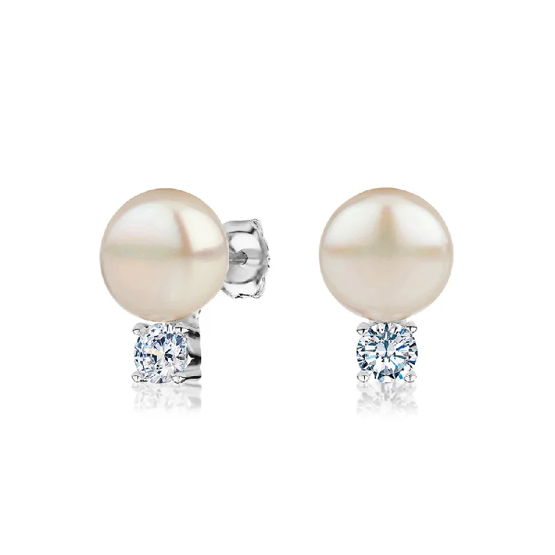 women's gemstone earrings-Cultured freshwater pearl stud earrings in sterling silver