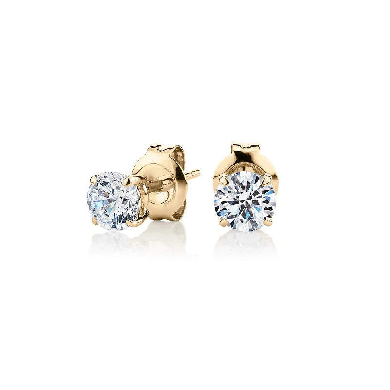 women's infinity earrings-Round Brilliant stud earrings with 1 carat* of diamond simulants in 10 carat yellow gold