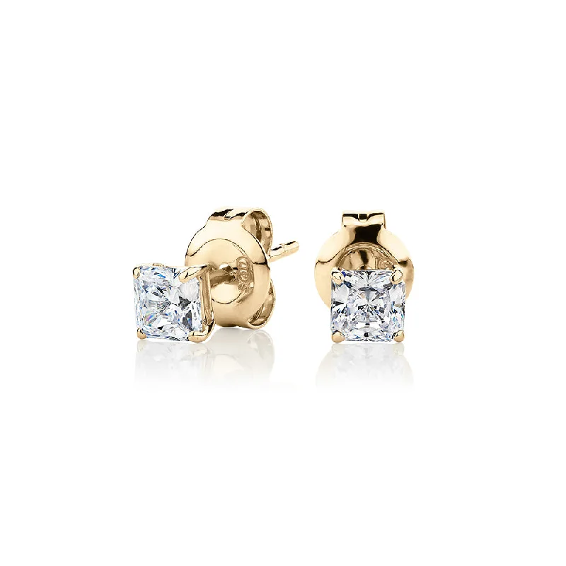 women's geometric design earrings-Princess Cut stud earrings with 0.5 carats* of diamond simulants in 10 carat yellow gold