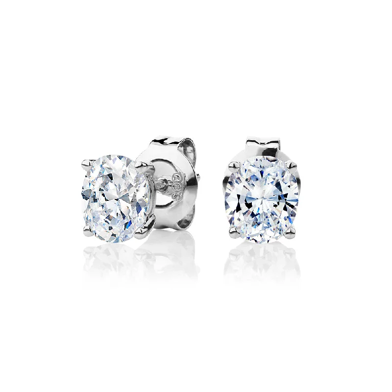 women's engagement earrings-Oval stud earrings with 1.22 carats* of diamond simulants in 10 carat white gold