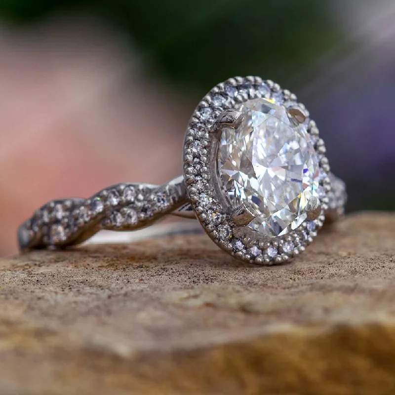 women's diamond wedding and engagement rings-Platinum Engagement Ring with Oval Shaped Diamond Halo